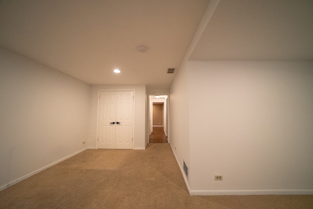 interior space with baseboards, visible vents, recessed lighting, and carpet flooring
