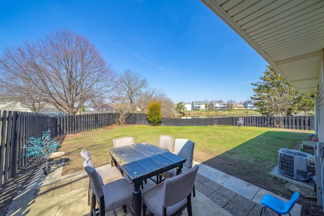 view of patio / terrace with a fenced backyard, outdoor dining area, and central AC unit