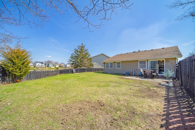 view of yard with a fenced backyard and a patio