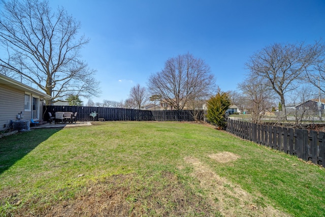 view of yard with a patio area, a fenced backyard, and central air condition unit
