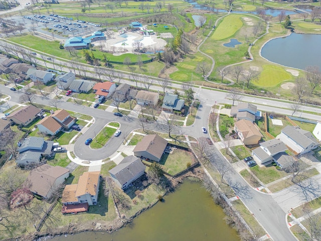 birds eye view of property with a residential view, golf course view, and a water view
