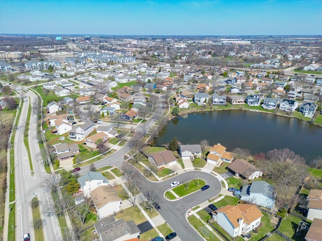 drone / aerial view featuring a residential view and a water view