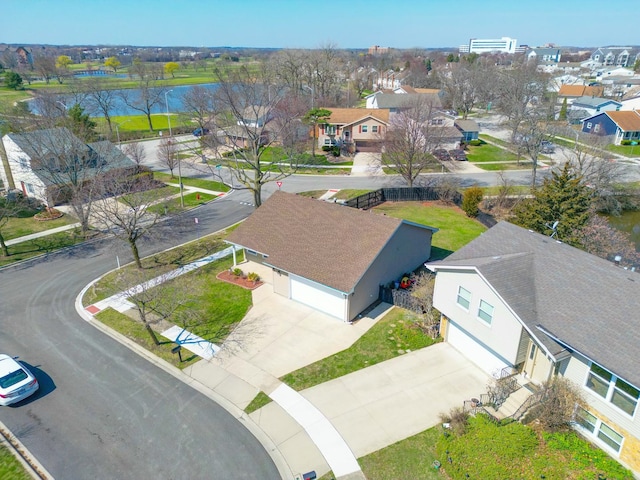 bird's eye view with a water view and a residential view