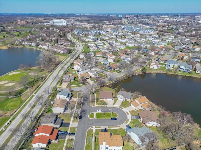 birds eye view of property featuring a residential view and a water view