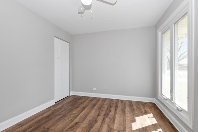 8907 S Komensky Ave, Hometown, IL 60456 - empty room featuring ceiling fan, baseboards, and dark wood finished floors