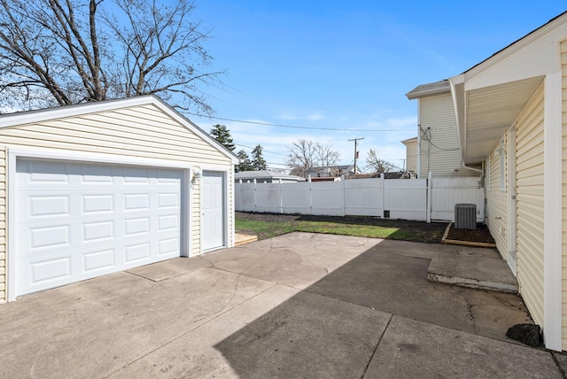 8907 S Komensky Ave, Hometown, IL 60456 - detached garage with driveway, fence, and central AC