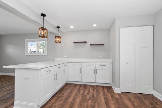 8907 S Komensky Ave, Hometown, IL 60456 - kitchen featuring light countertops, open shelves, a peninsula, and dark wood-style floors