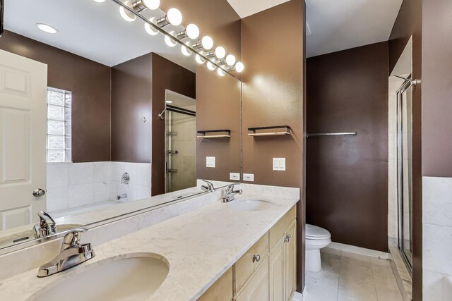 4860 N Kenmore Ave Unit 4S, Chicago, IL 60640 - bathroom with toilet, a stall shower, double vanity, and a garden tub