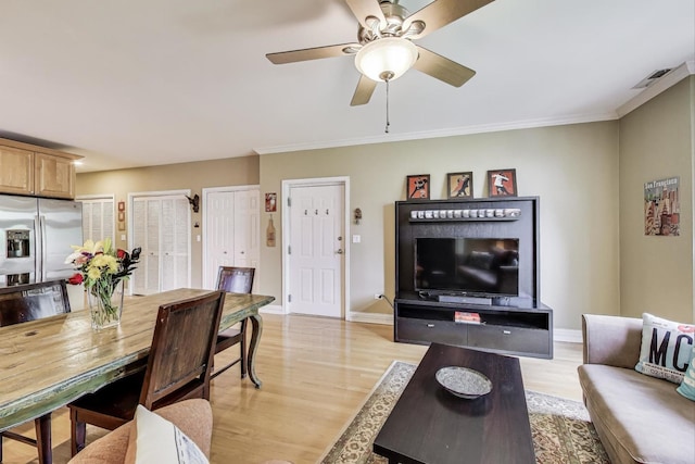 4860 N Kenmore Ave Unit 4S, Chicago, IL 60640 - living area featuring light wood-style floors, ceiling fan, baseboards, and ornamental molding