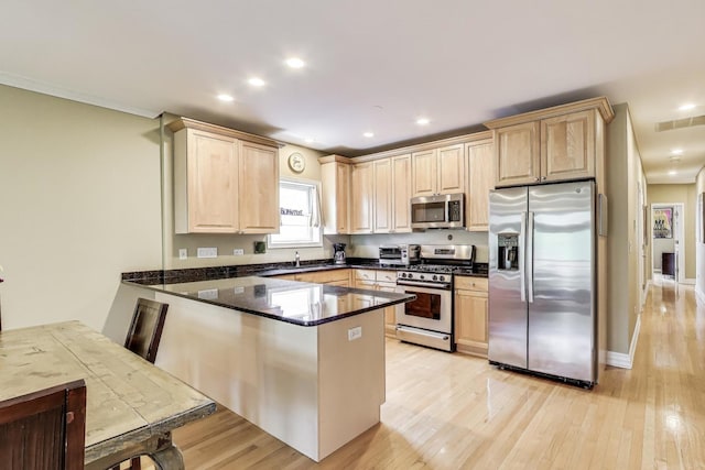 4860 N Kenmore Ave Unit 4S, Chicago, IL 60640 - kitchen with stainless steel appliances, a peninsula, light brown cabinetry, light wood-style flooring, and recessed lighting