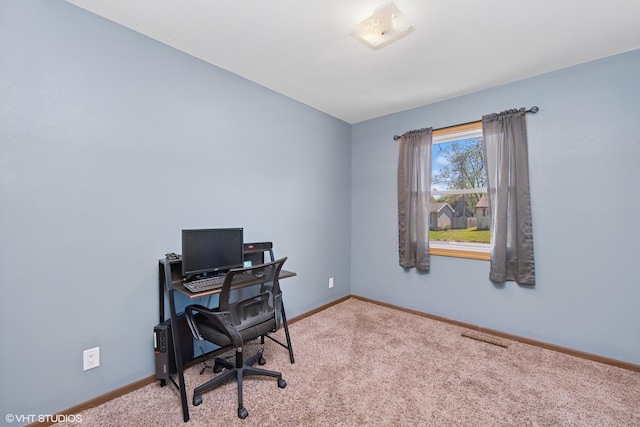 carpeted office space with baseboards