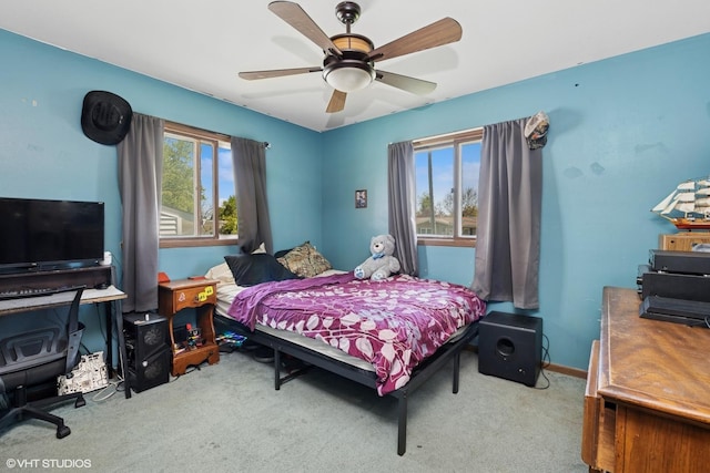carpeted bedroom featuring a ceiling fan