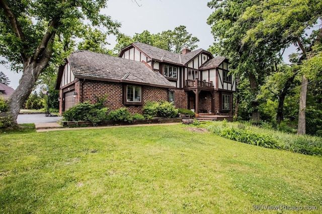 304 Polo Ln, Oak Brook, IL 60523 - tudor house with brick siding, a balcony, a garage, and a front lawn