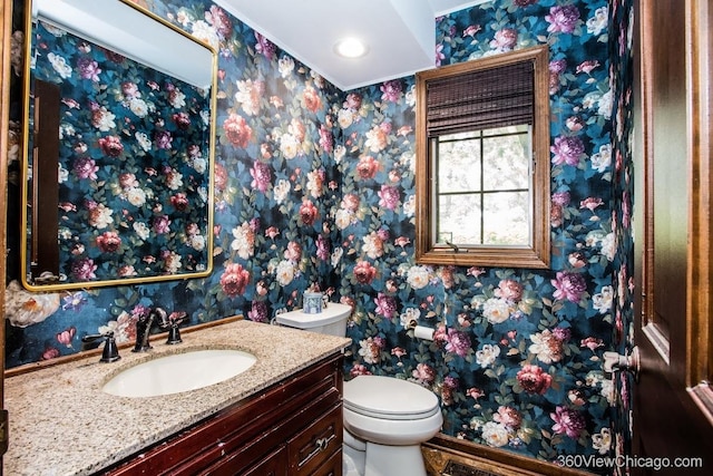 304 Polo Ln, Oak Brook, IL 60523 - bathroom featuring wallpapered walls, toilet, vanity, baseboards, and recessed lighting