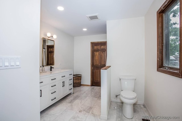 304 Polo Ln, Oak Brook, IL 60523 - full bath featuring vanity, toilet, baseboards, recessed lighting, and marble finish floors