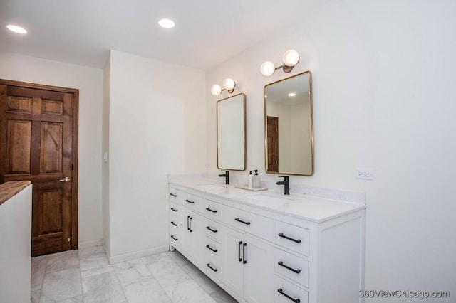 304 Polo Ln, Oak Brook, IL 60523 - bathroom featuring double vanity, recessed lighting, marble look tile flooring, and baseboards