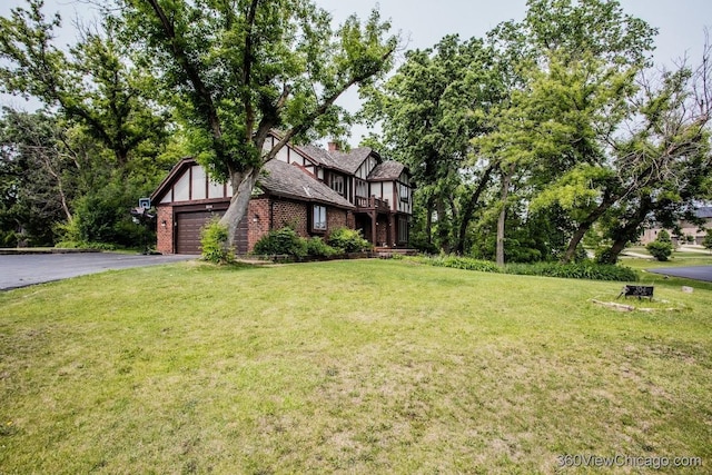 304 Polo Ln, Oak Brook, IL 60523 - view of front of property featuring driveway, a garage, brick siding, and a front lawn