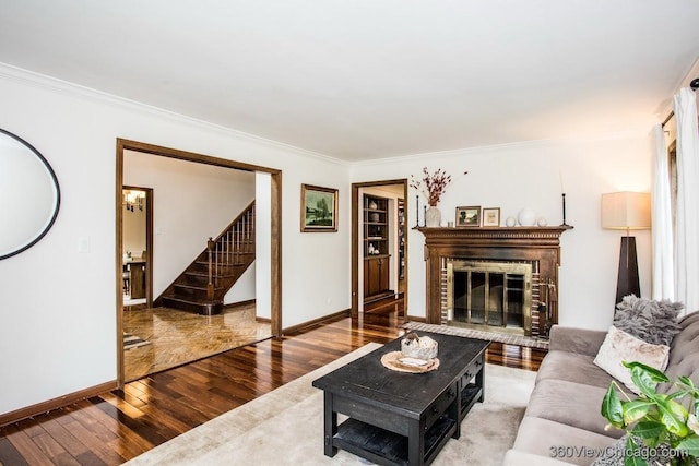 304 Polo Ln, Oak Brook, IL 60523 - living area featuring wood-type flooring, crown molding, stairs, a fireplace, and baseboards