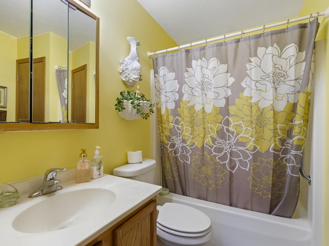 bathroom featuring shower / tub combo, vanity, toilet, and a textured ceiling