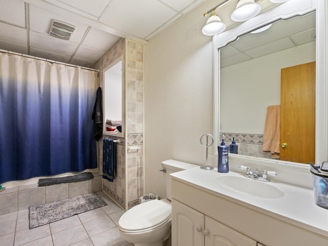 full bath featuring tile patterned floors, visible vents, toilet, and vanity
