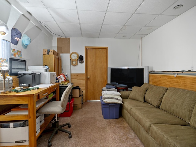home office with a paneled ceiling and carpet