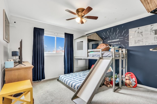 bedroom with a ceiling fan, carpet flooring, baseboards, and ornamental molding