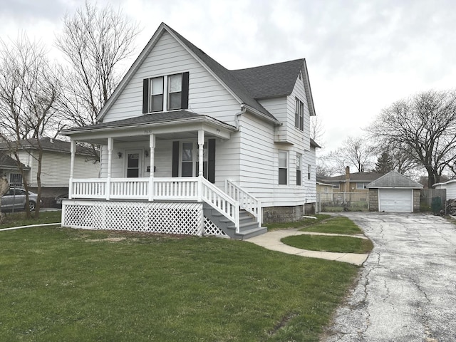 15630 Drexel Ave, Dolton, IL 60419 - bungalow featuring a detached garage, a front lawn, aphalt driveway, an outdoor structure, and a porch