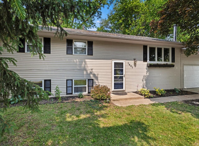 1407 Centennial Dr, Champaign, IL 61821 - view of front of property featuring a front lawn and an attached garage