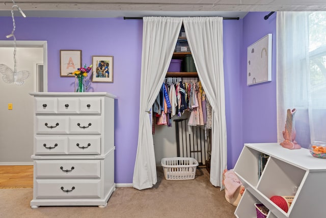 1407 Centennial Dr, Champaign, IL 61821 - bedroom with light colored carpet and a chandelier
