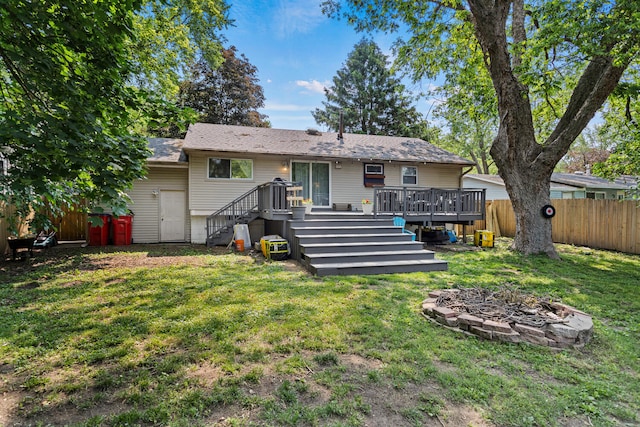 1407 Centennial Dr, Champaign, IL 61821 - back of property with stairway, a fenced backyard, and a wooden deck