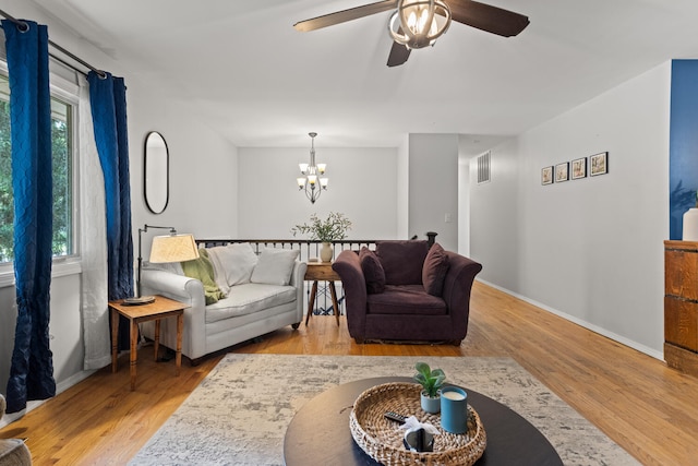 1407 Centennial Dr, Champaign, IL 61821 - living area featuring ceiling fan, wood finished floors, and a chandelier