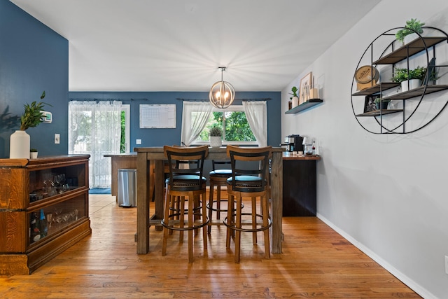 1407 Centennial Dr, Champaign, IL 61821 - dining room with plenty of natural light, wood finished floors, and a chandelier