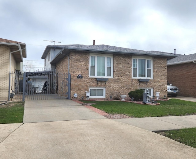 11723 S S Ave J, Chicago, IL 60617 - exterior space with brick siding, a front lawn, a gate, and driveway