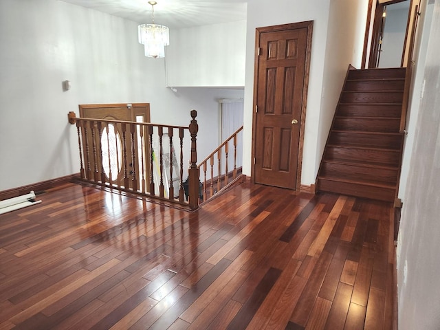 11723 S S Ave J, Chicago, IL 60617 - stairs featuring an inviting chandelier, baseboards, and hardwood / wood-style flooring