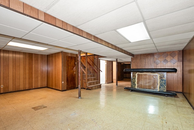 640 W 95th St, Chicago, IL 60628 - finished basement with wood walls, tile patterned floors, a paneled ceiling, and stairs