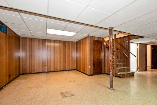 640 W 95th St, Chicago, IL 60628 - finished basement with wooden walls, a drop ceiling, light floors, and stairs