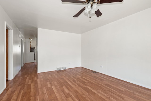 640 W 95th St, Chicago, IL 60628 - unfurnished room featuring visible vents, ceiling fan, baseboards, and wood finished floors