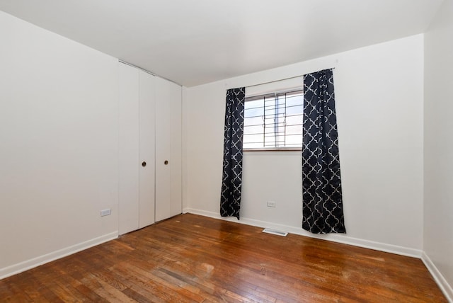 640 W 95th St, Chicago, IL 60628 - spare room with baseboards and hardwood / wood-style floors