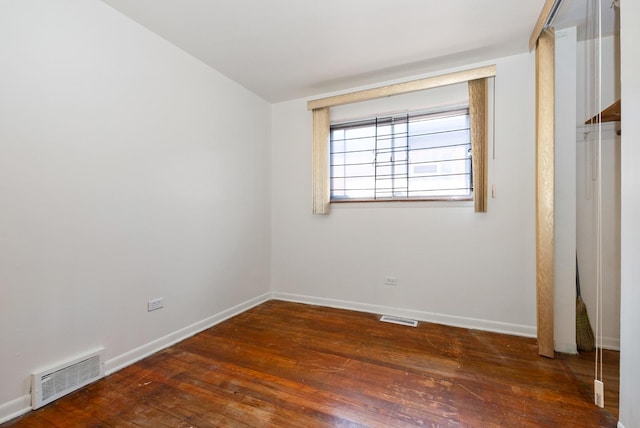 640 W 95th St, Chicago, IL 60628 - unfurnished bedroom featuring visible vents, baseboards, and wood-type flooring