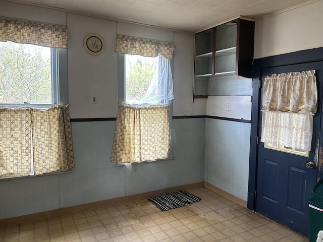 kitchen with light floors and baseboards