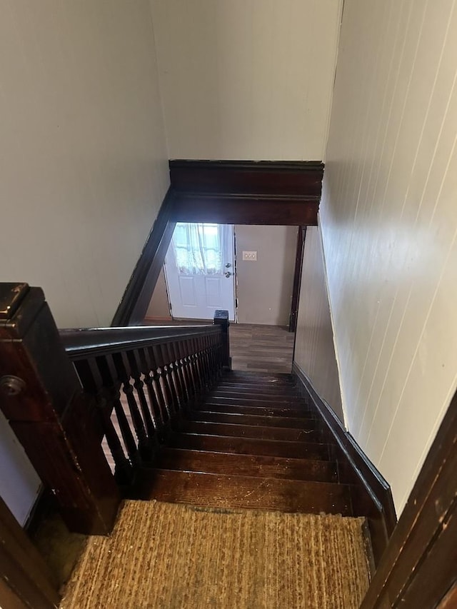 stairs with wood-type flooring