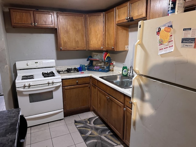 1842 S Drake Ave, Chicago, IL 60623 - kitchen featuring white appliances, light countertops, light tile patterned flooring, brown cabinets, and a sink