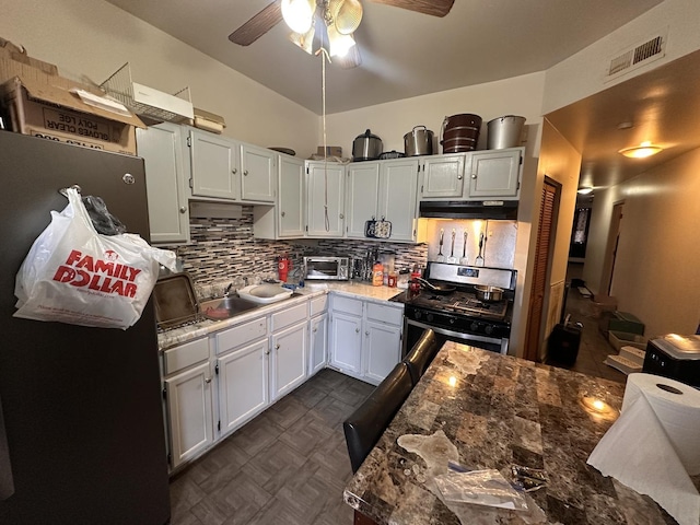 1842 S Drake Ave, Chicago, IL 60623 - kitchen with a ceiling fan, under cabinet range hood, a sink, stainless steel gas range oven, and backsplash