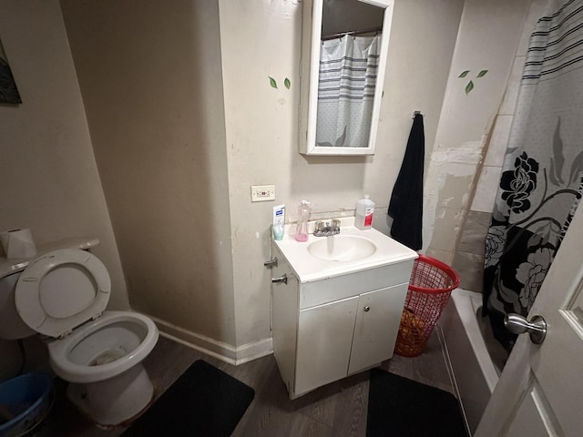 1842 S Drake Ave, Chicago, IL 60623 - bathroom featuring toilet, vanity, wood finished floors, and baseboards