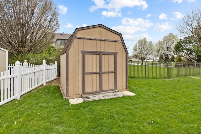 view of shed with a fenced backyard