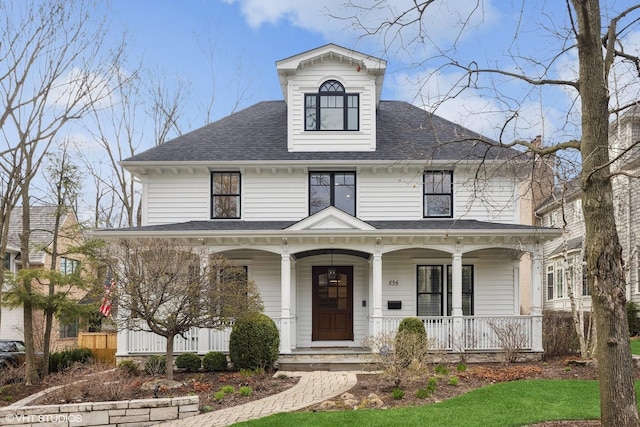 view of front of house featuring covered porch and roof with shingles