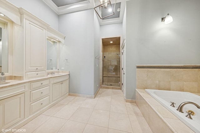 bathroom with a bath, a sink, double vanity, a stall shower, and ornamental molding