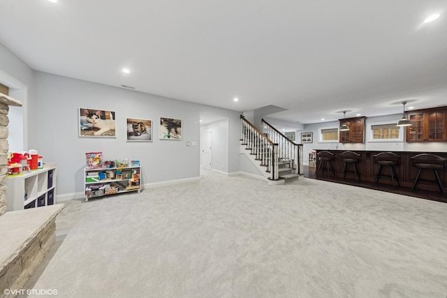 game room featuring indoor bar, carpet floors, baseboards, and recessed lighting