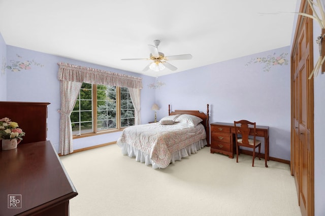 carpeted bedroom with baseboards, ceiling fan, and a closet