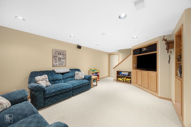 living room featuring recessed lighting and light colored carpet